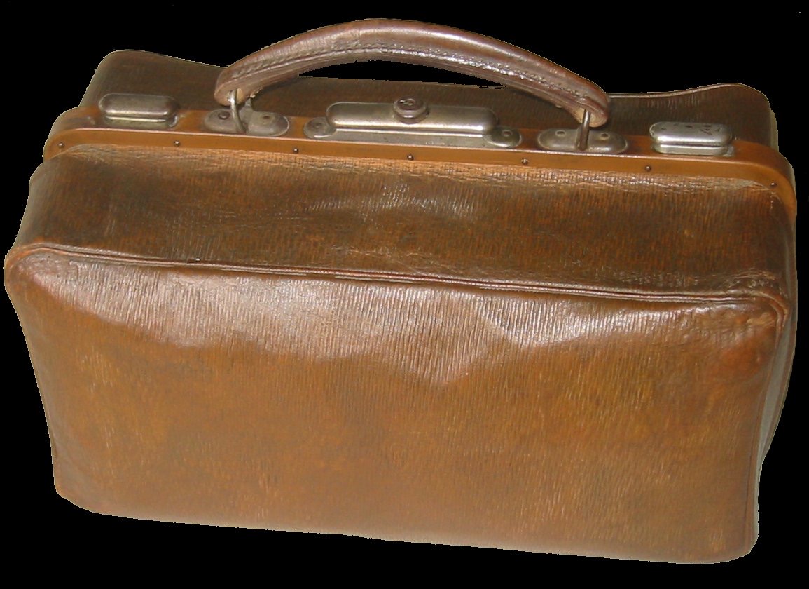 An old stiff leather traveling bag with a hinged frame that opens the top into two equal halves