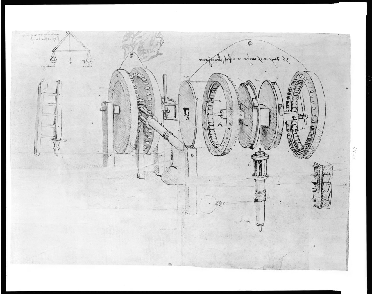 A page from Leonardo da Vinci's notebooks: careful drawings of toothed wheels and a shaft, with lines of handwriting that run backwards