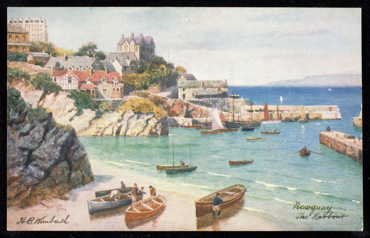 A painted view of a small harbor: boats drawn up on sheltered sand inside a curving stone wall, with a village climbing the cliff above